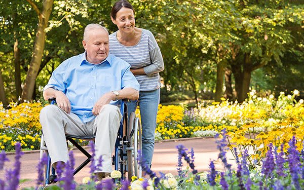 A senior living resident and caregiver at Artis Senior Living of Boca Raton