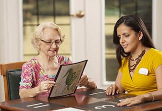 Woman and caregiver at memory care in Portage