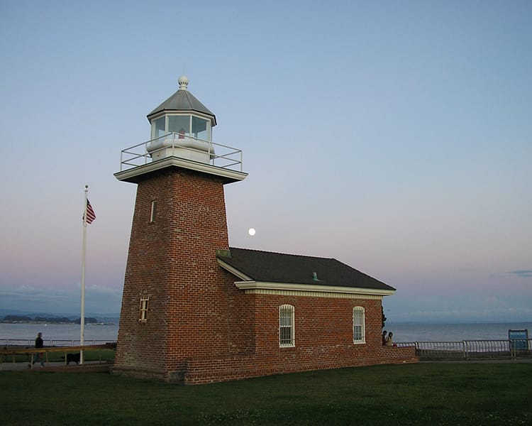 View of a local lighthouse at dusk near Pacific Shores apartments