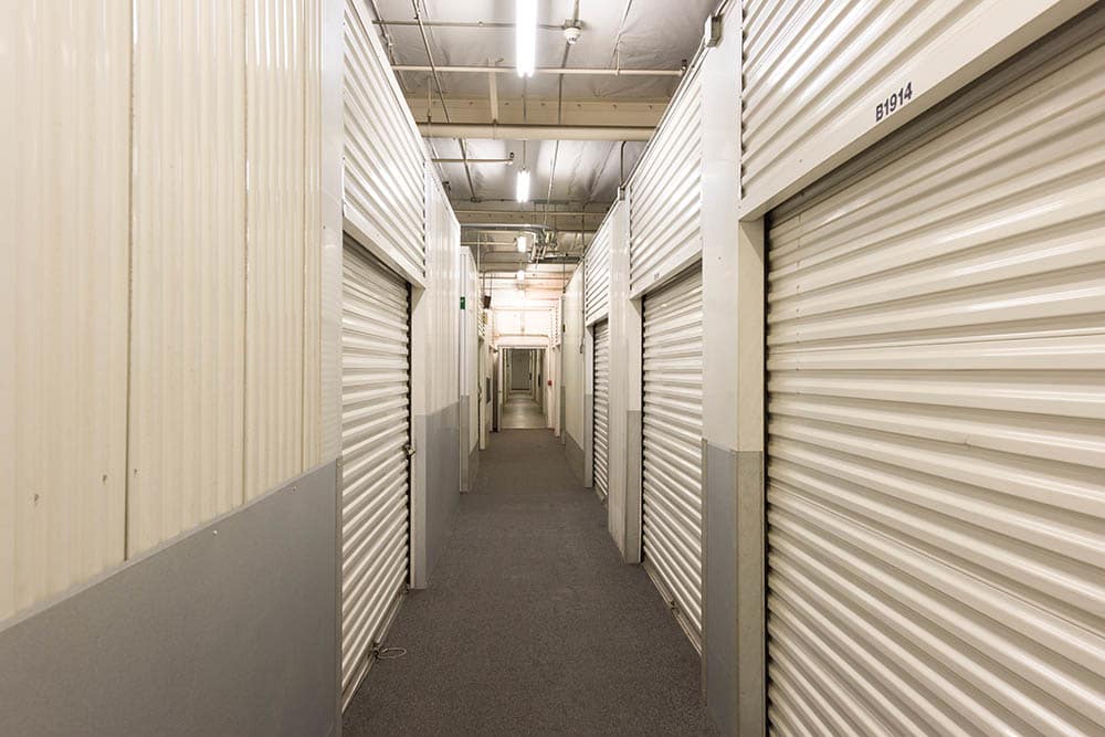 Lit hallway at self storage facility in Pasadena, CA.
