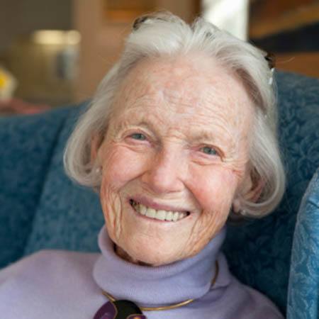 Woman sitting in armchair