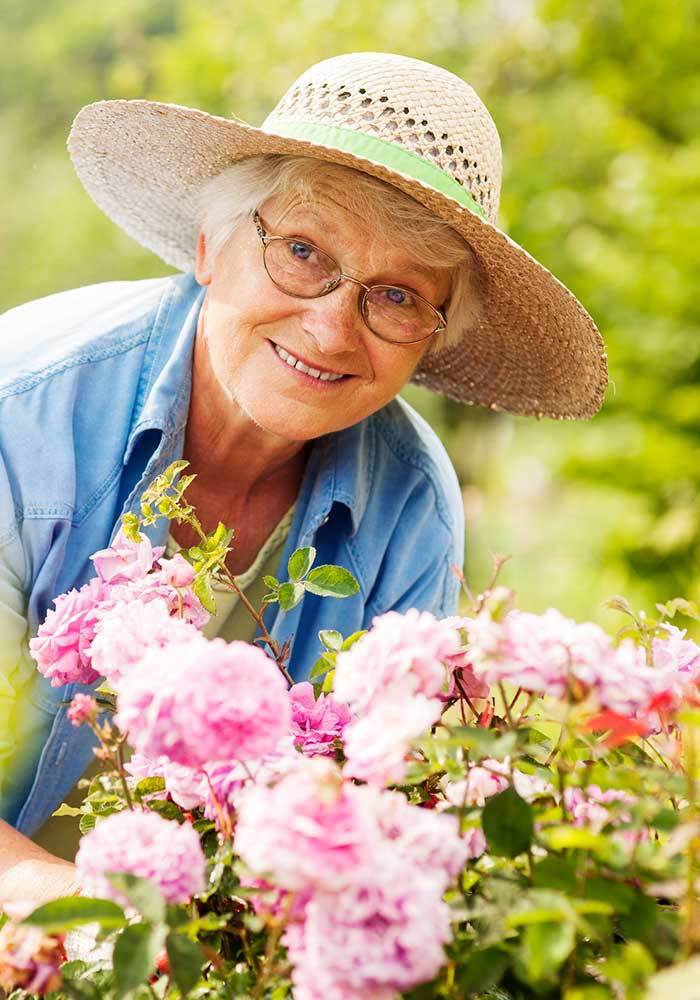 Woman gardening at The Terraces at Park Marino in Pasadena