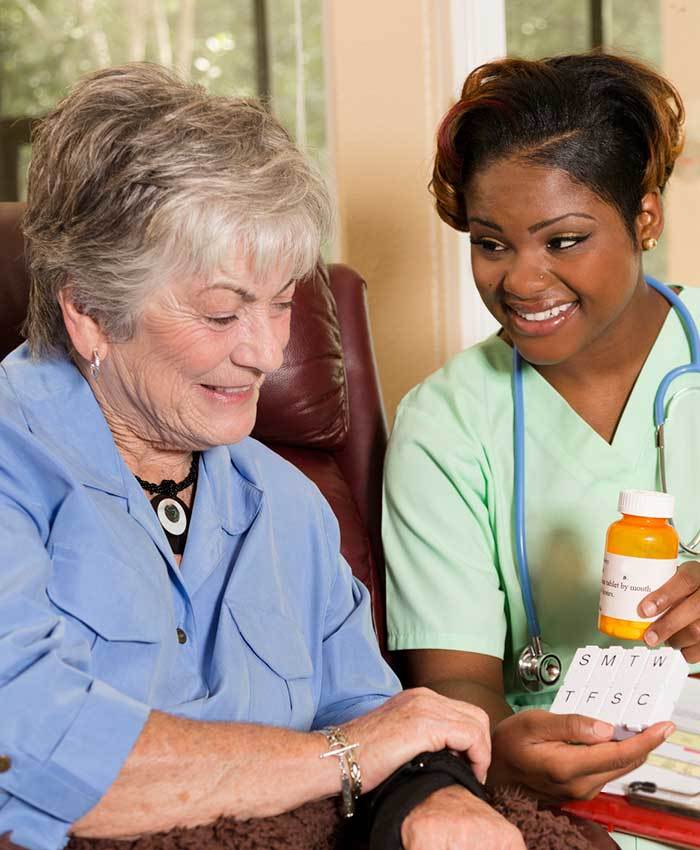 Nurse tending to resident at The Terraces at Park Marino