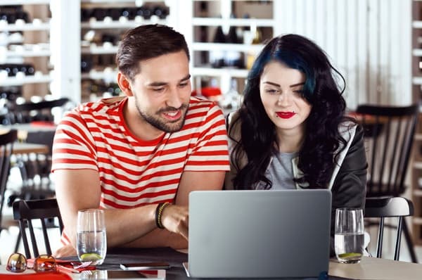 Young couple enjoys their apartment floor plan at EVO Apartments