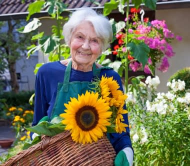 Senior enjoying the garden at Sienna at Otay Ranch