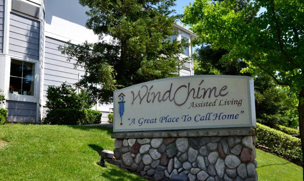 Front sign with on top of grassy knoll of Windchime of Chico in Chico, California.