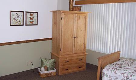Bedroom with armoire at The Homestead Assisted Living in Fallon, Nevada