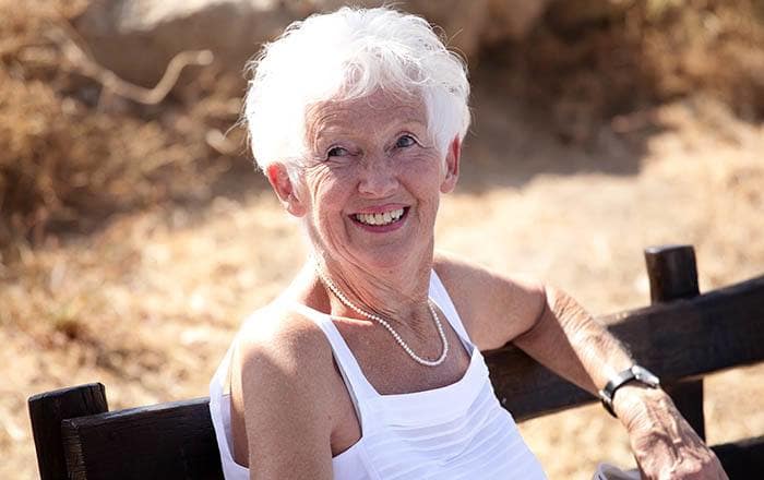 Woman enjoying the sunshine at The Meadows - Assisted Living