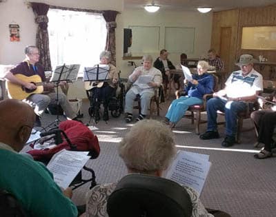 Resident singing at Avalon Assisted Living Community.