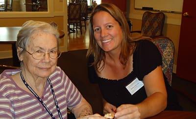 Staff and resident at Flower Mound Assisted Living.