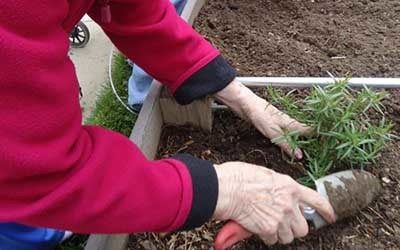Staff and resident at Garden Square of Greeley Assisted Living and Memory Care.