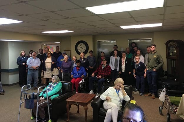 Group photo of Wood Ridge Assisted Living residents and staff