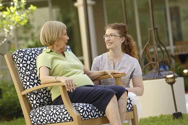 A resident and nurse chat at Lakeside at Mallard Landing in Salisbury, MD.