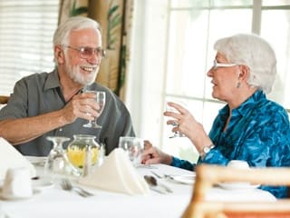 A couple having a Sensations Dining dinner at Lakeside at Mallard Landing