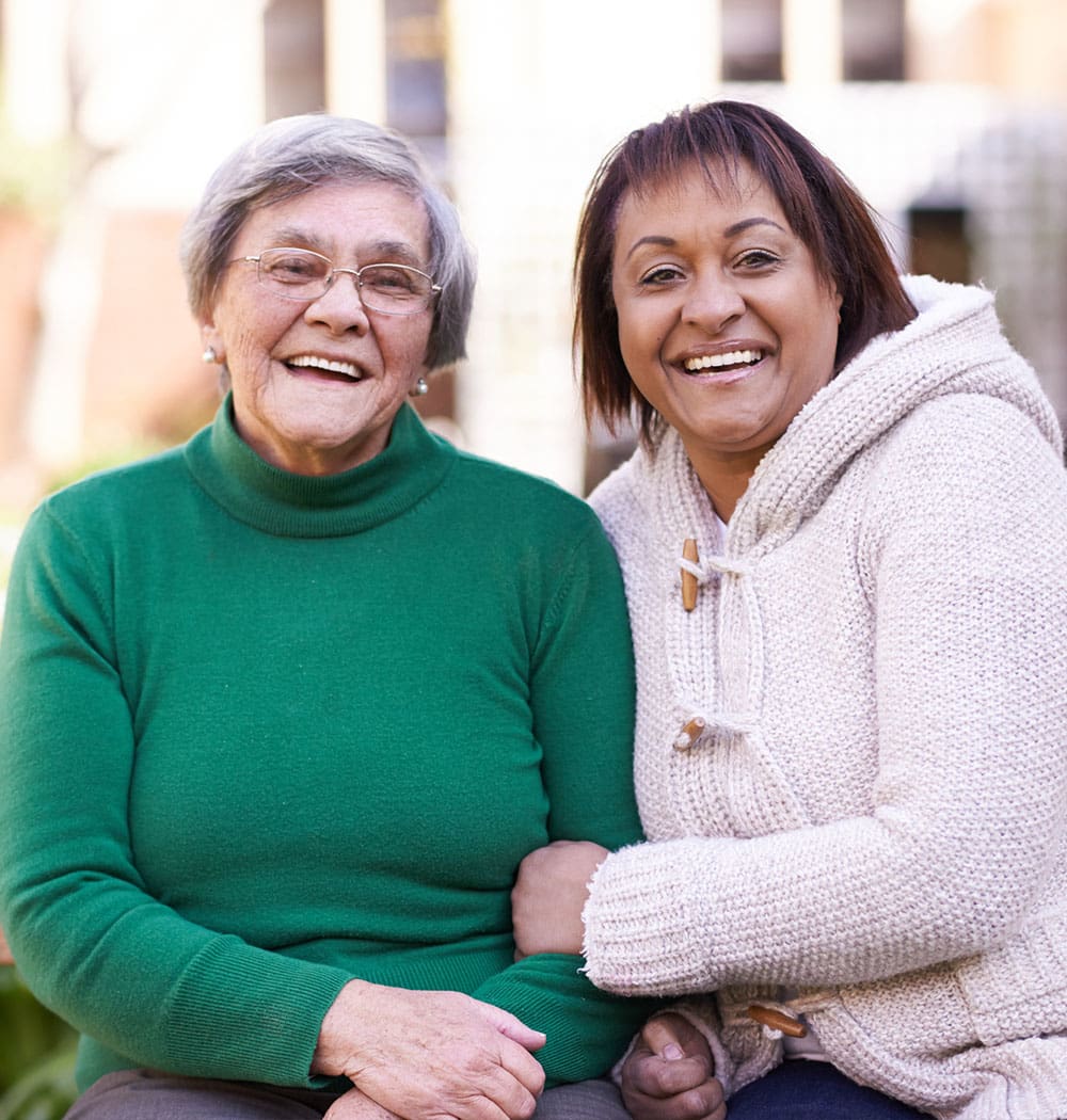 Two women laughing at Waltonwood Cary Parkway