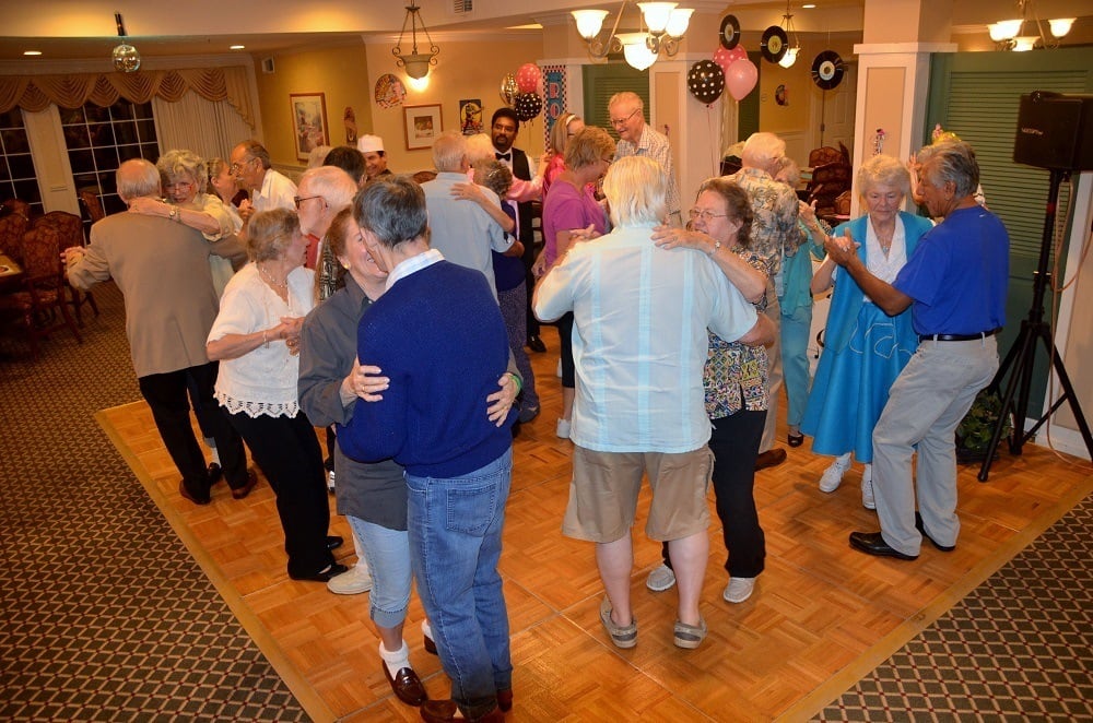 Residents dancing at Merrill Gardens at Santa Maria in Santa Maria, California. 