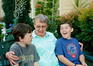 Resident with her grandchildren at Campbell senior living