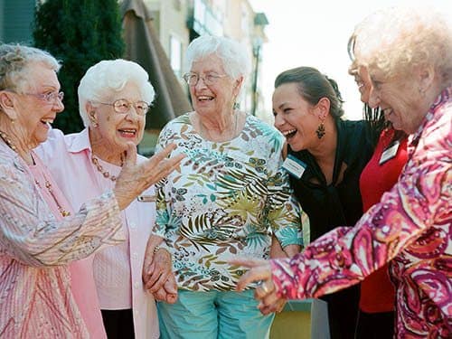 Seniors living a happy life here at Merrill Gardens at Huntington Beach