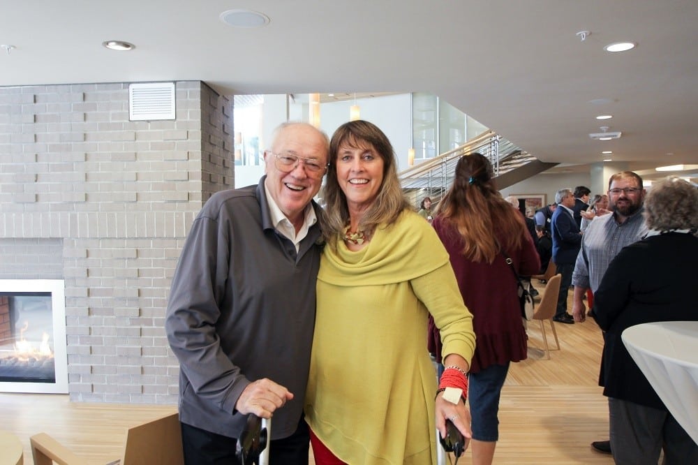 Resident and family enjoying a community event together at Merrill Gardens at Ballard in Seattle, Washington. 