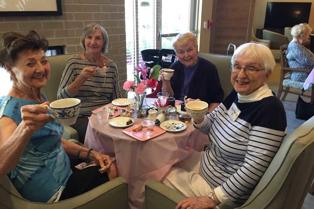 Residents enjoying tea at Merrill Gardens at Burien in Burien, Washington. 