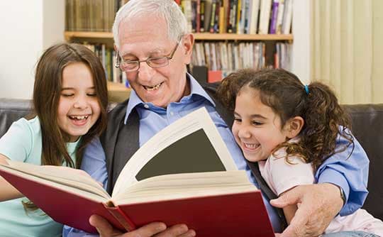 Resident reading to grand kids at Parkview on Hollybrook
