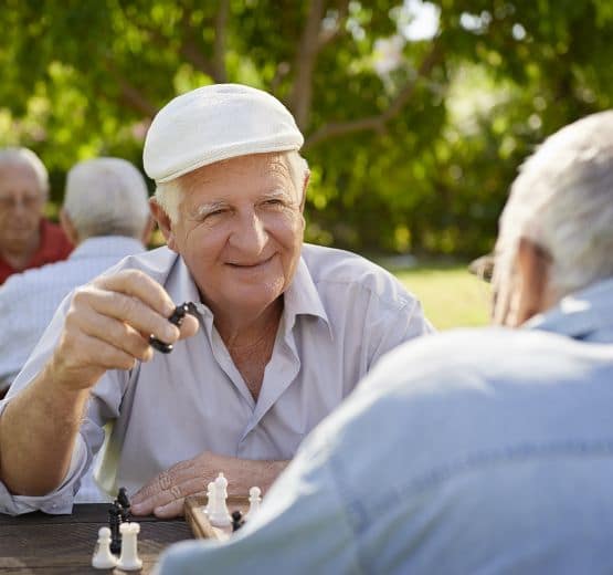 Men playing chess at Reunion Court of Kingwood in Kingwood, Texas