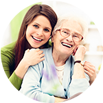 Caretaker having a conversation with a senior living resident at Cedar Bluff Assisted Living & Memory Care
