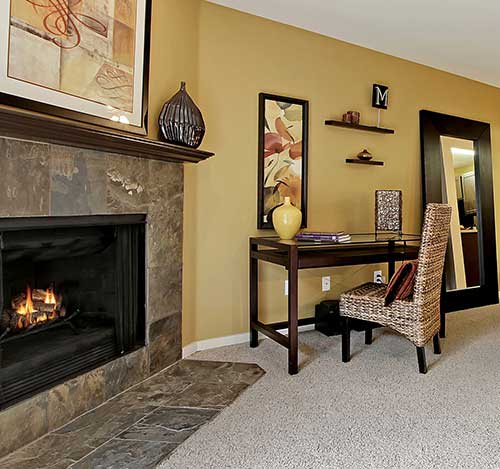 The fireplace is an excellent apartment amenity at The Mill at Mill Creek Apartments.