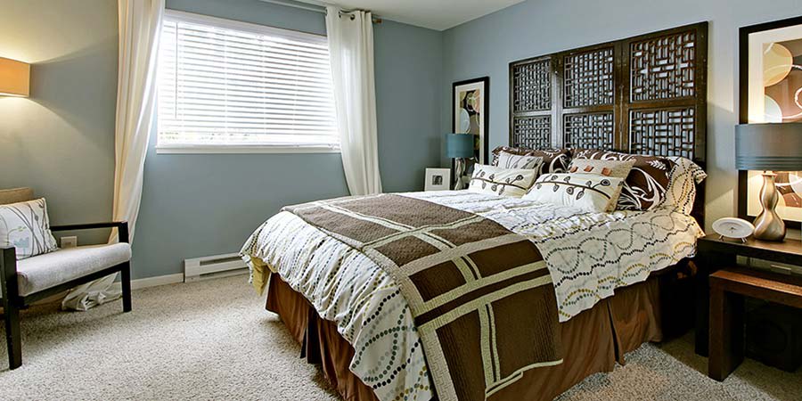 Master bedroom at The Mill at Mill Creek Apartments