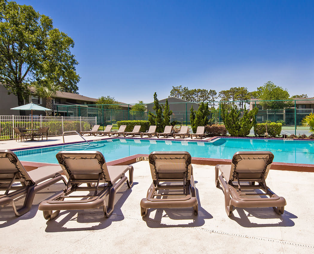 Sit near the pool at Arbors at Orange Park