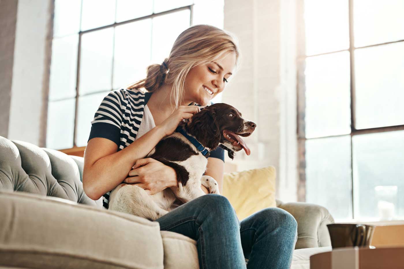 55 West Apartments resident and her dog sharing a moment