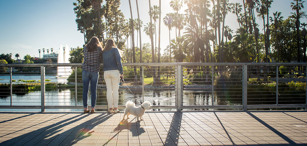 55 West Apartments residents out with their dog enjoying the neighborhood