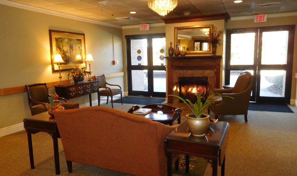 resident lounge with fireplace at The Columbia Presbyterian Community in Lexington, SC