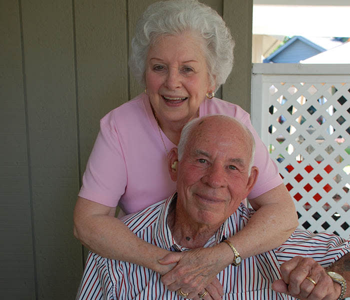 Woman embracing man at The Village at Summerville.