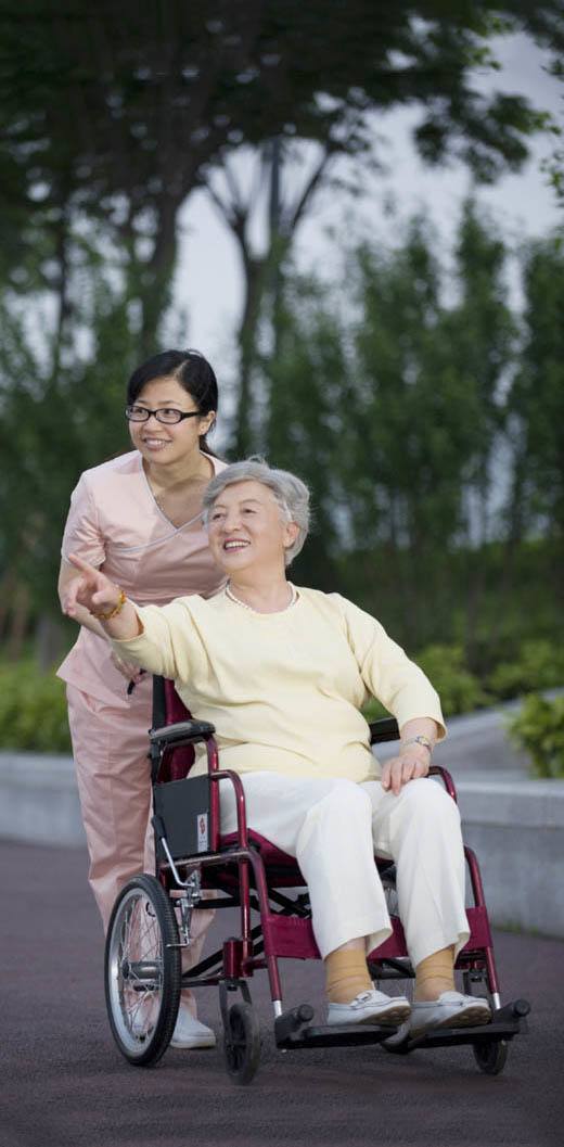 Nurse and resident getting fresh air at our senior living community in Pudong