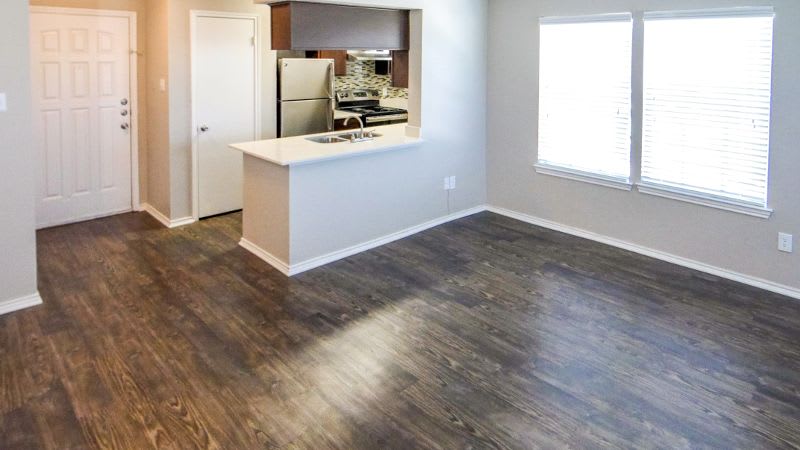 Living room, dining area and kitchen in apartments at Eagle's Point Apartments