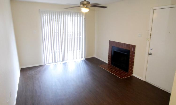 Sedona Square Apartments offers living rooms with a fireplace in Houston, TX