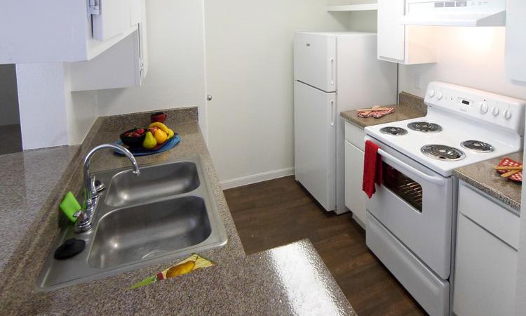 Modern kitchen at Newport Oaks Apartments in Alvin, TX