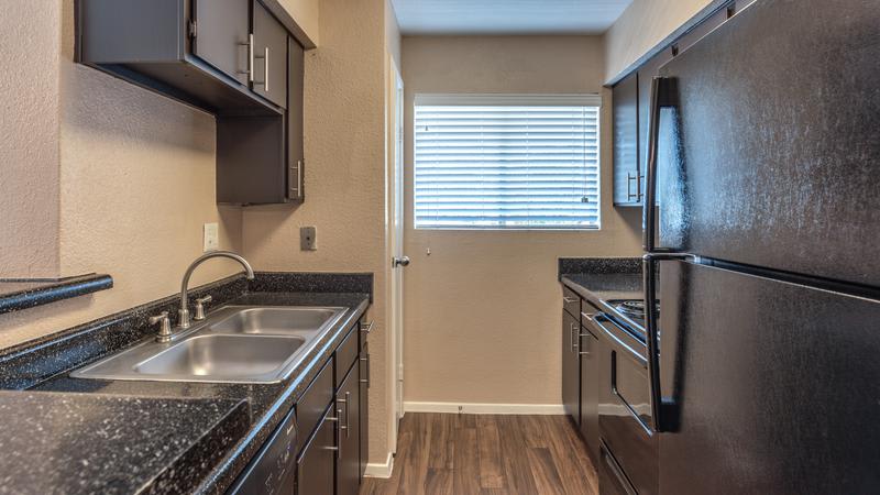 Narrow Design Kitchen Room at Verano Apartments in Houston, TX