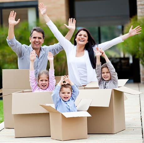 A family playing with boxes near Northwest Crossing Self Storage in Bend, Oregon