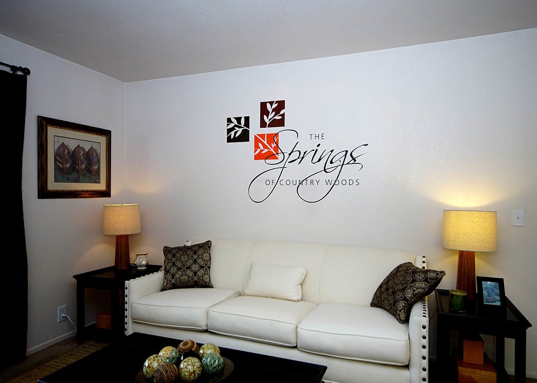 living room at Springs of Country Woods Apartments in Midvale