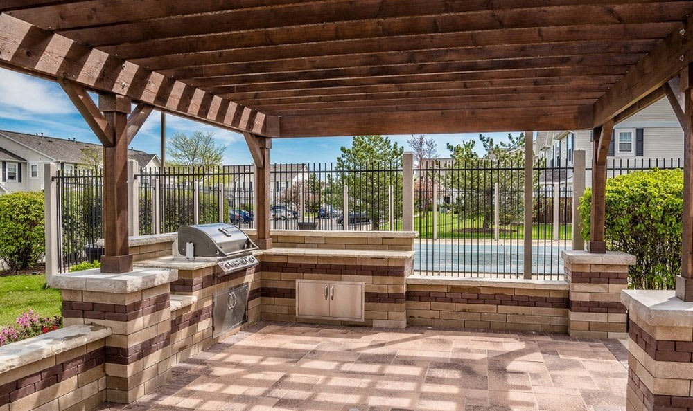 Outdoor grill and patio at apartments in Aurora