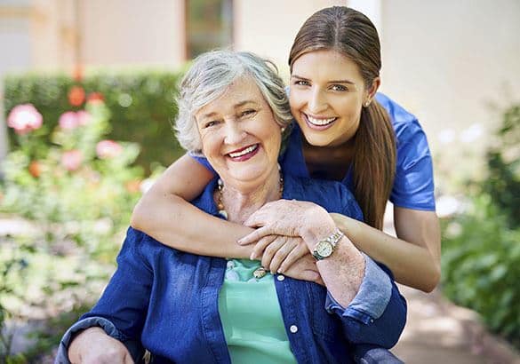 A senior resident at DELETED - Pacifica Senior Living McMinnville with her caretaker