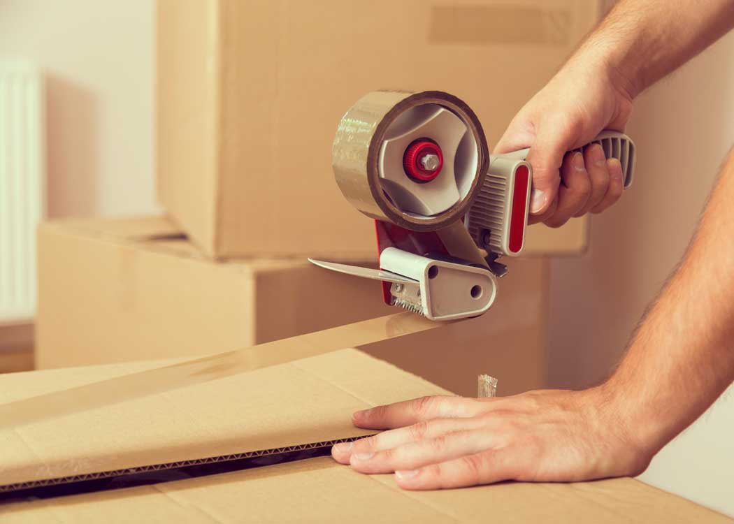 Packing up a box at Captain's Storage in Ontario