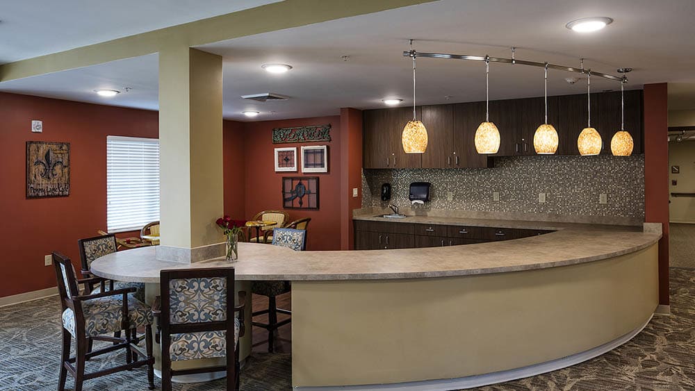 Community kitchen and bar at The Oxford Grand Assisted Living & Memory Care in McKinney, Texas