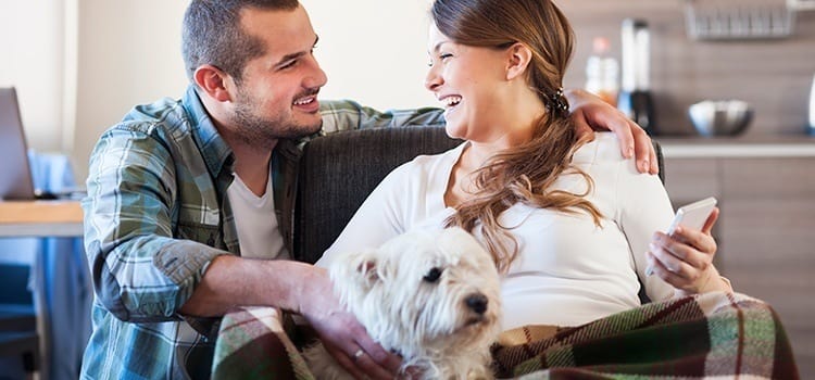 Couple with their dog at Chestnut Hills Apartments