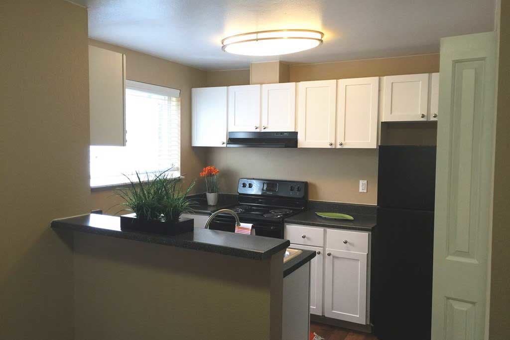 Modern kitchen in Village at Seeley Lake model home in Lakewood, Washington