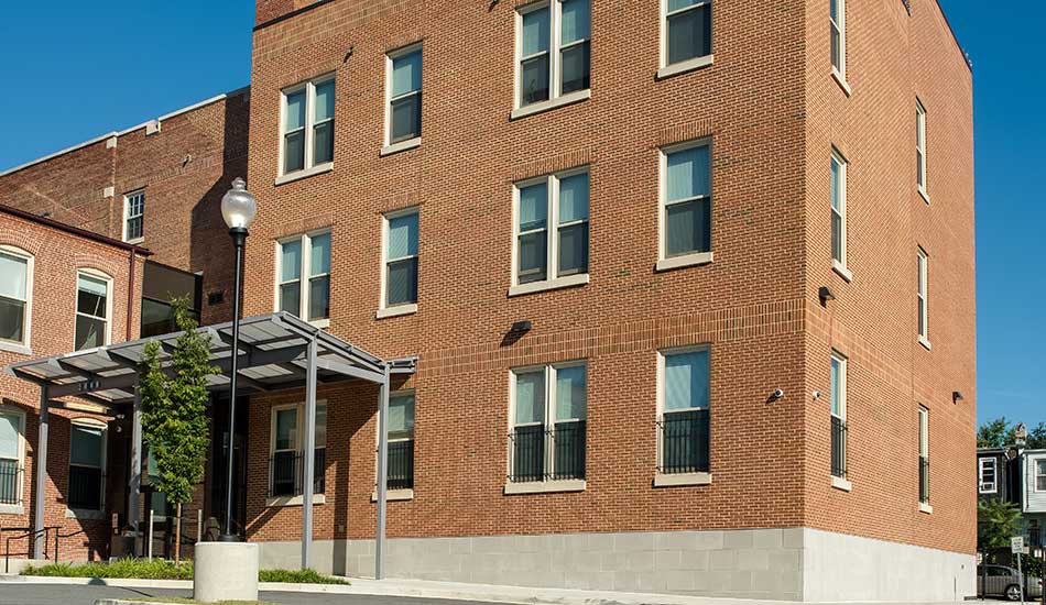 Exterior view of Columbus School Apartments in Baltimore