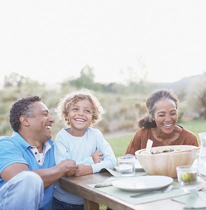 Family dining on patio on sunny day at Clearwater at South Bay in Torrance, California
