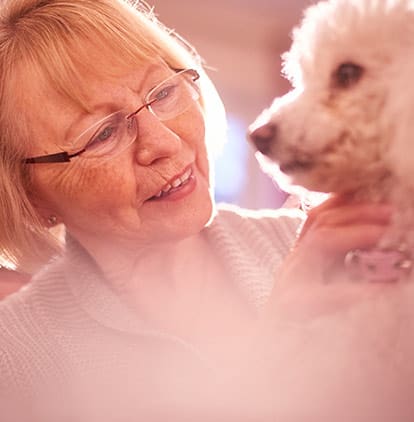 A woman with a poodle at Clearwater at Sonoma Hills in Rohnert Park, California